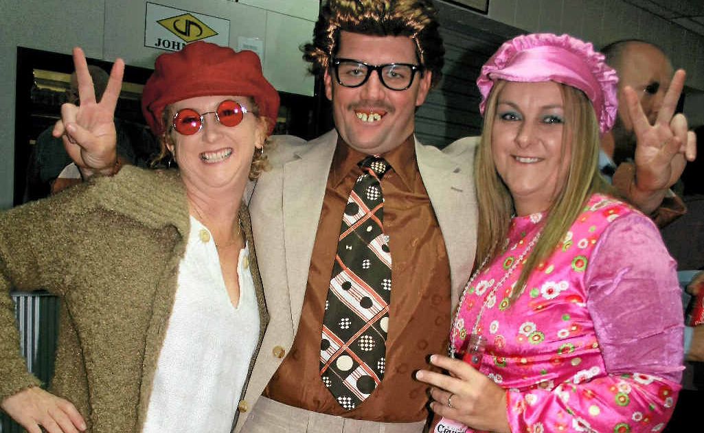 Lisa and Craig Frattini and Dee Stevens get their mojo on at the ’60s themed fundraiser.